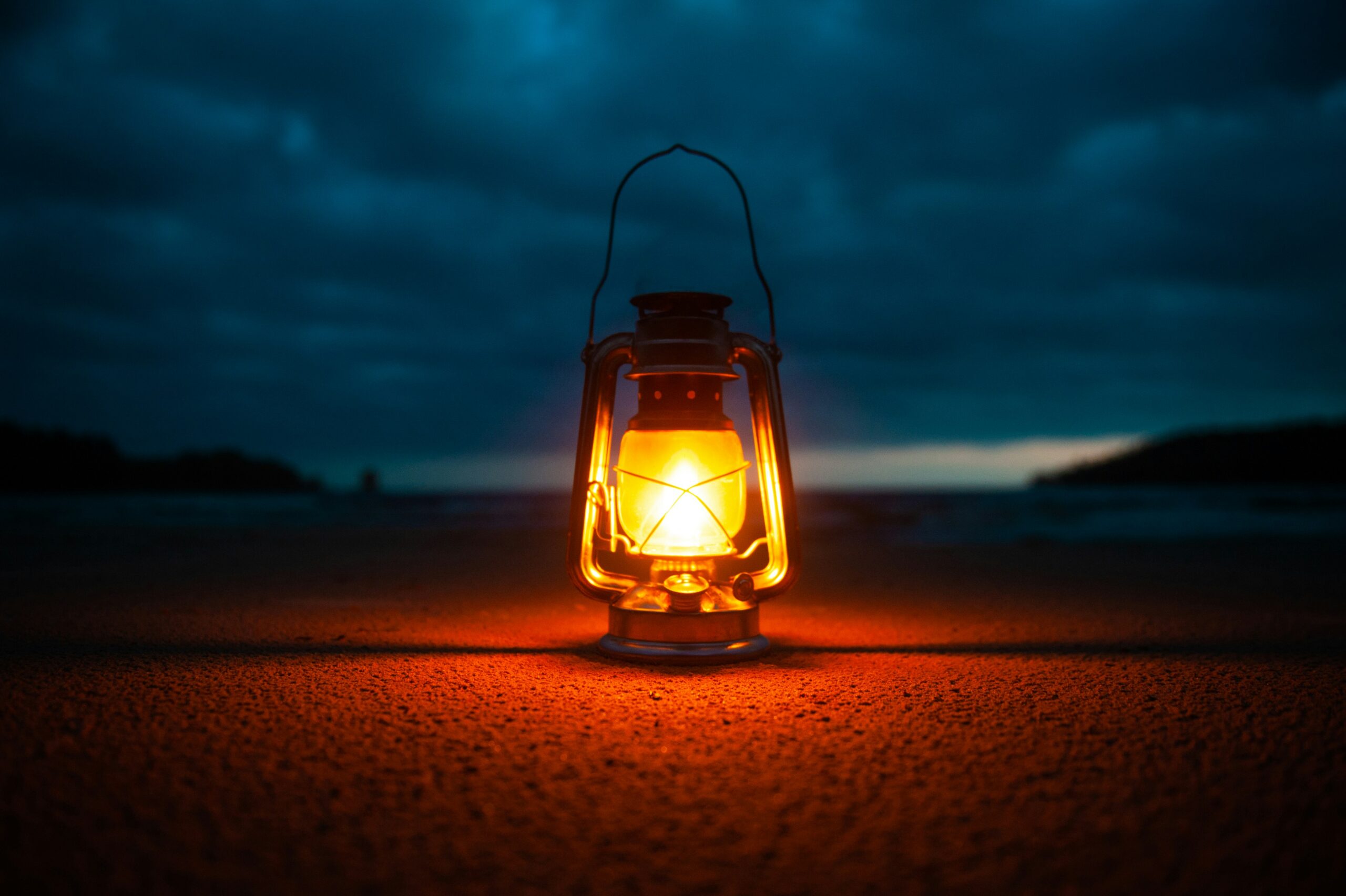 A lighted kerosene lantern glowing in the dark